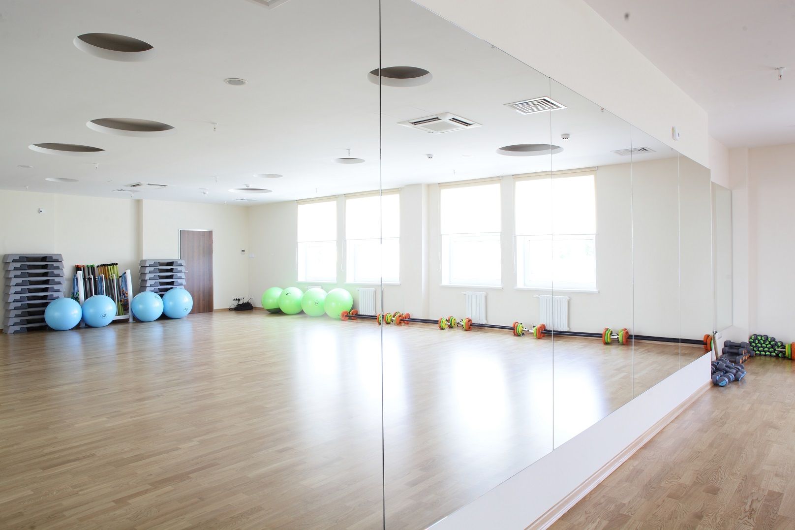 Wall-to-wall studio mirror installation