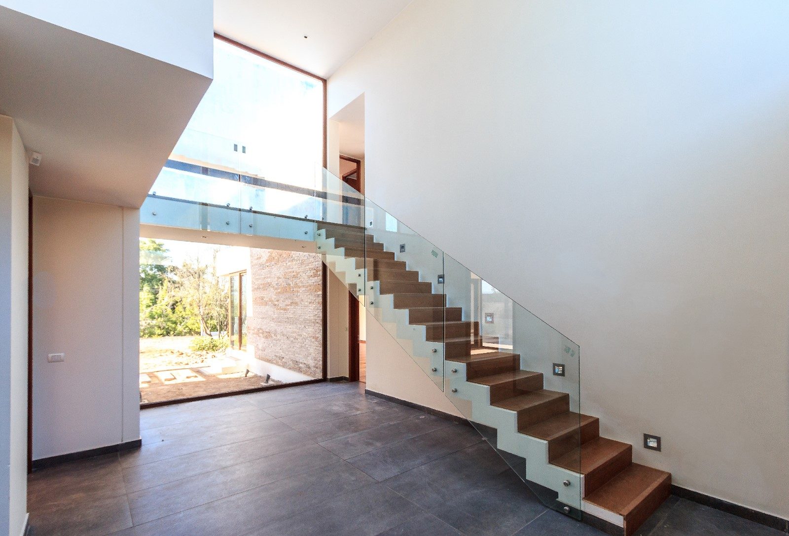 Frameless glass railing on an interior staircase