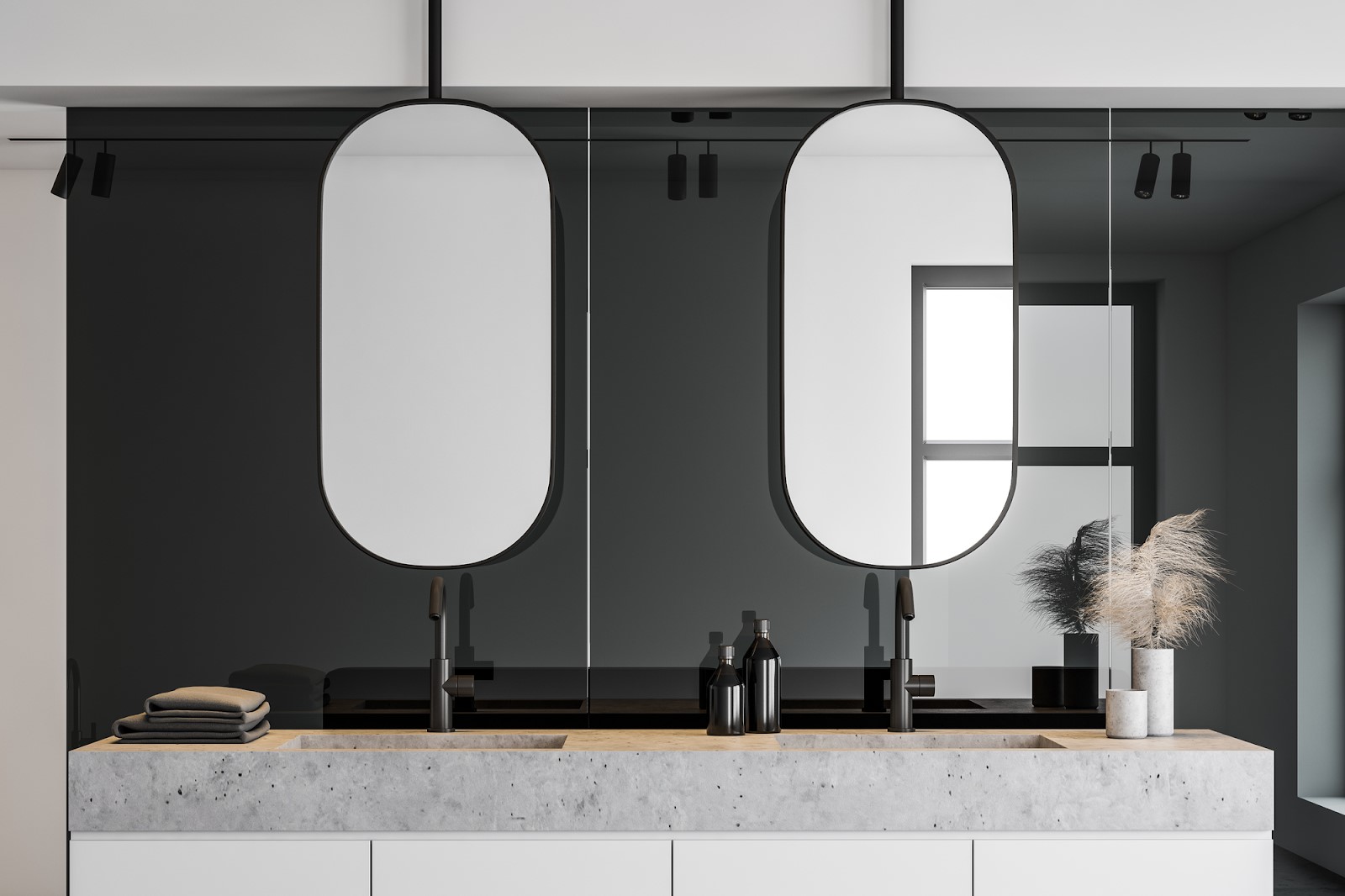 Pair of custom-cut mirrors above a stone vanity