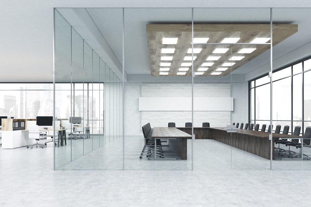 Glass-walled meeting room in an open-plan office